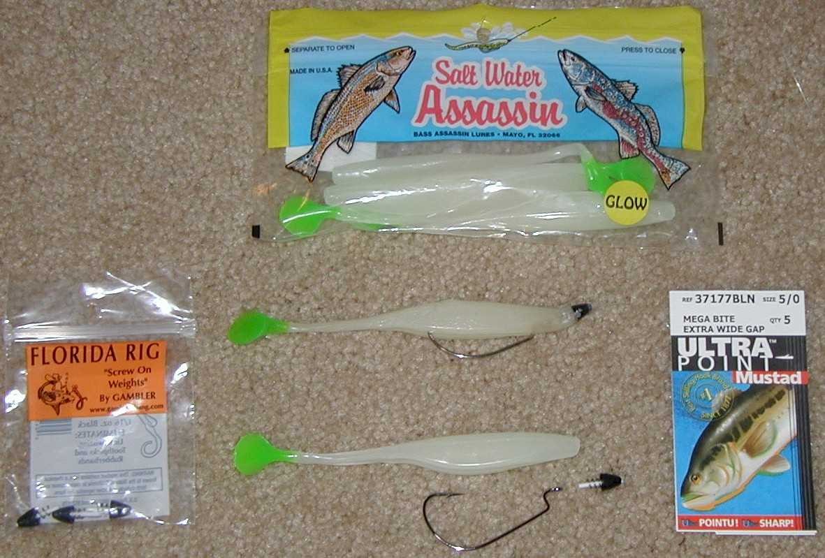 Soft plastic lure rigged weedless on a lead head hook, with the hook point tucked into the lure's belly
